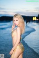 Atittaya Chaiyasing beauty poses hot on the beach with a yellow bikini (41 photos) P9 No.ce8e63