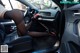 A woman sitting in the driver's seat of a car.